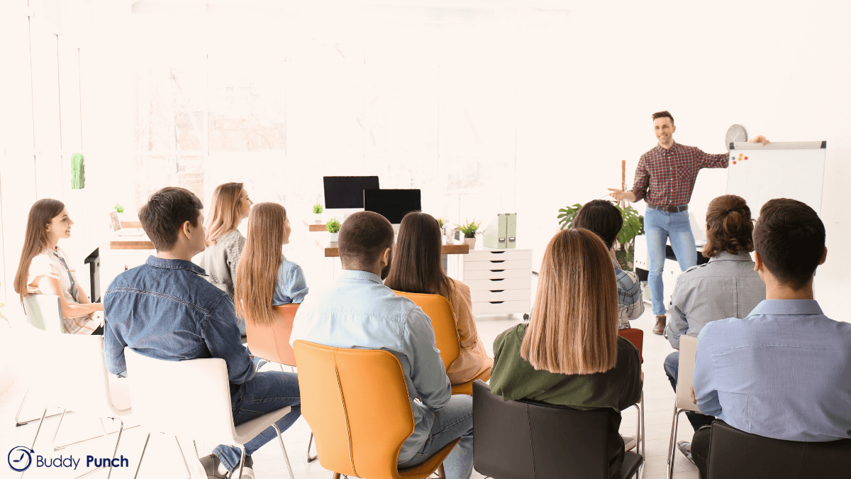 Good employee teaching other employees essential information about the business.