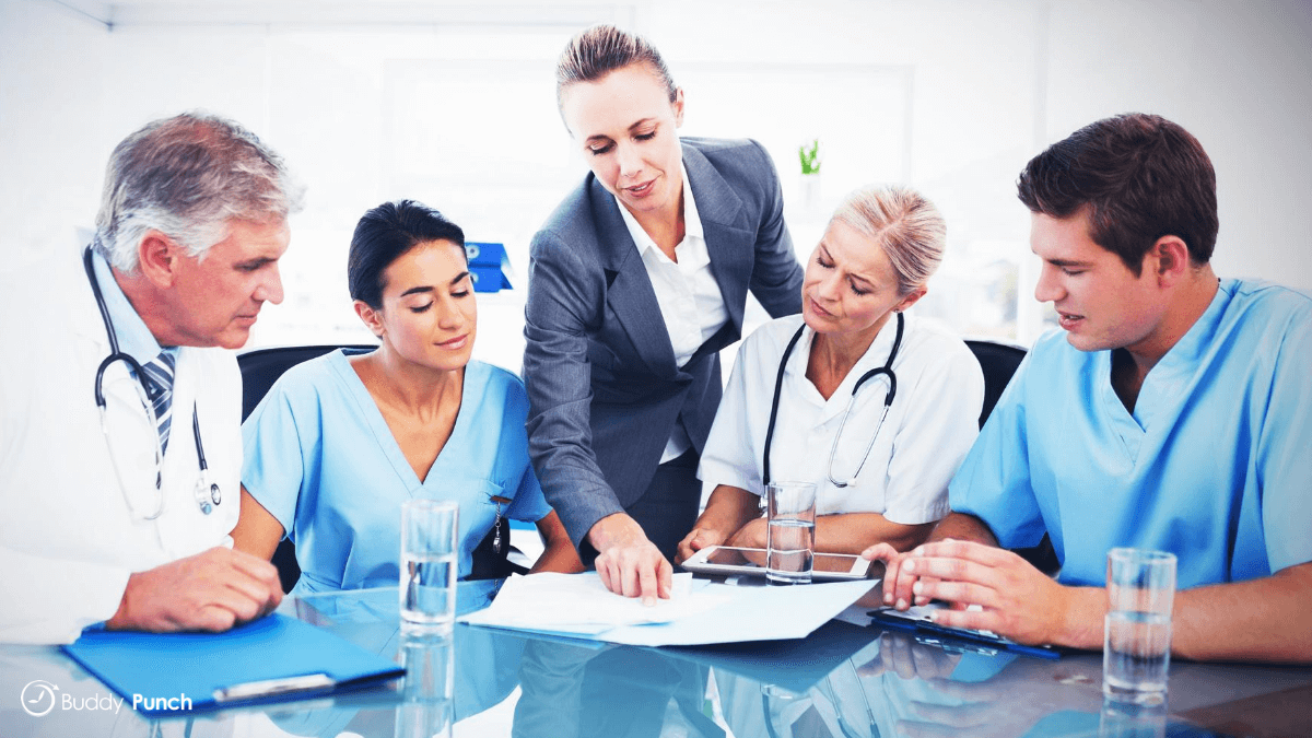 Medical staff reviewing appointments for the next few days to ensure everything is ready to go when the patient arrives.