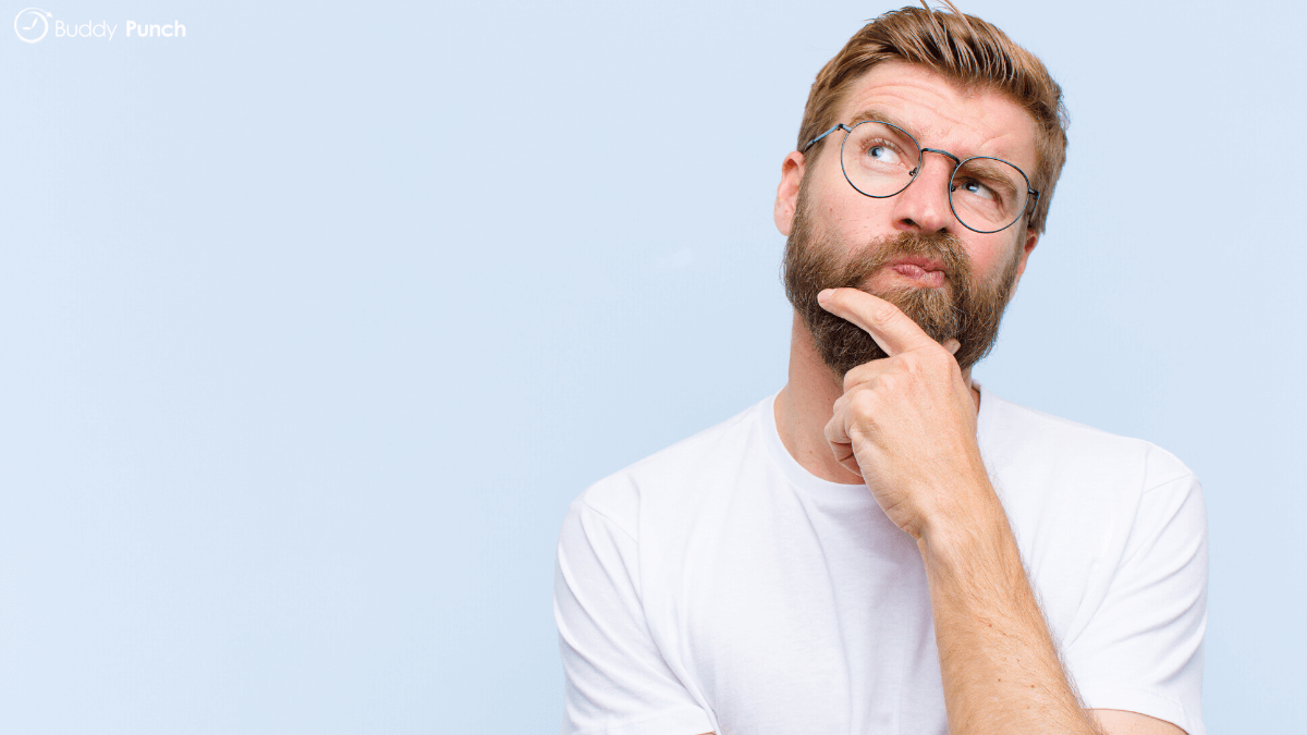 Man thinking about the different time clock solutions that are available and the different features they offer.