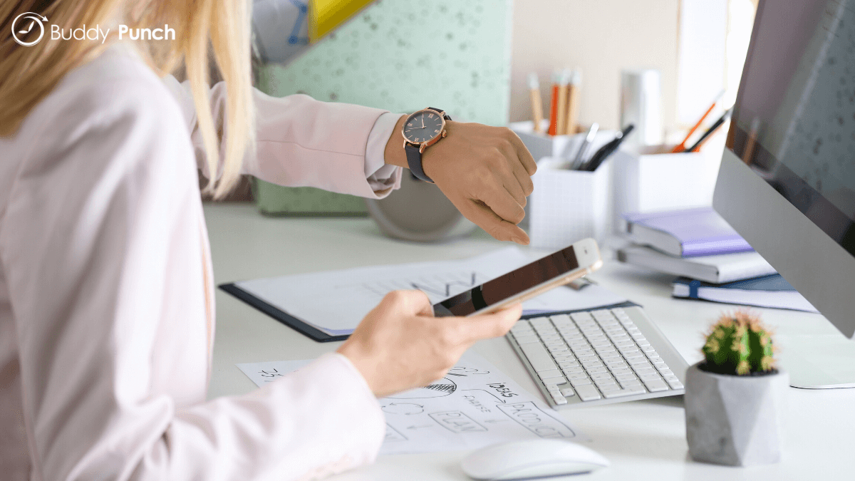 Woman tracking her hours using a time tracking app for iphone. 