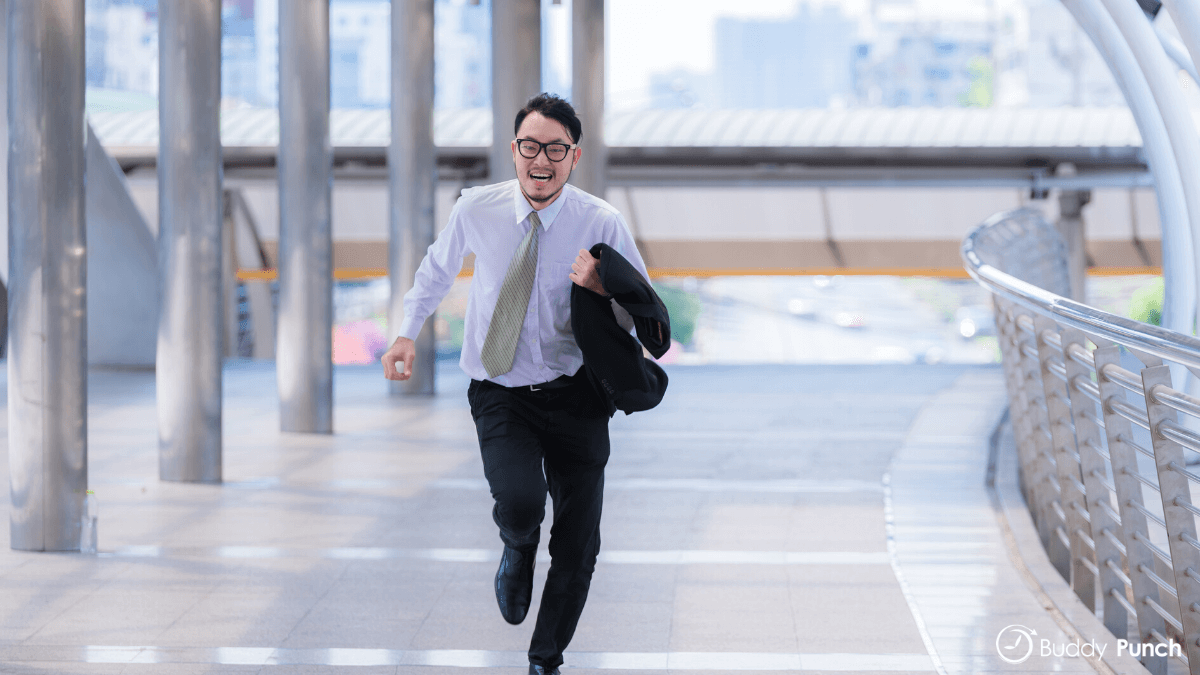 Employee who is late to work running to make sure they don't arrive any later.