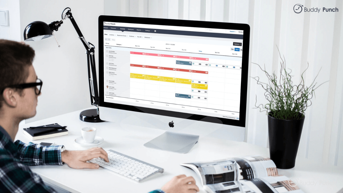 Manager creating a schedule using Buddy Punch time clock and scheduling software.