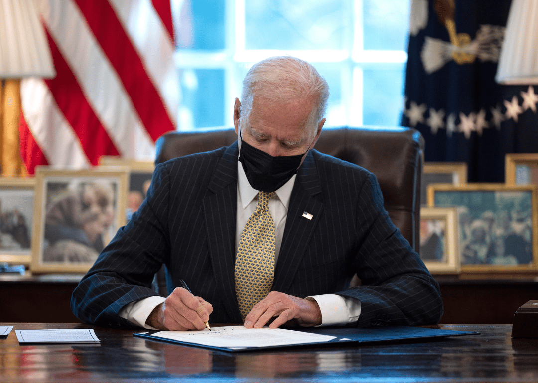 President Joe Biden signing the Paycheck Protection Program Extension Act of 2021 into law.